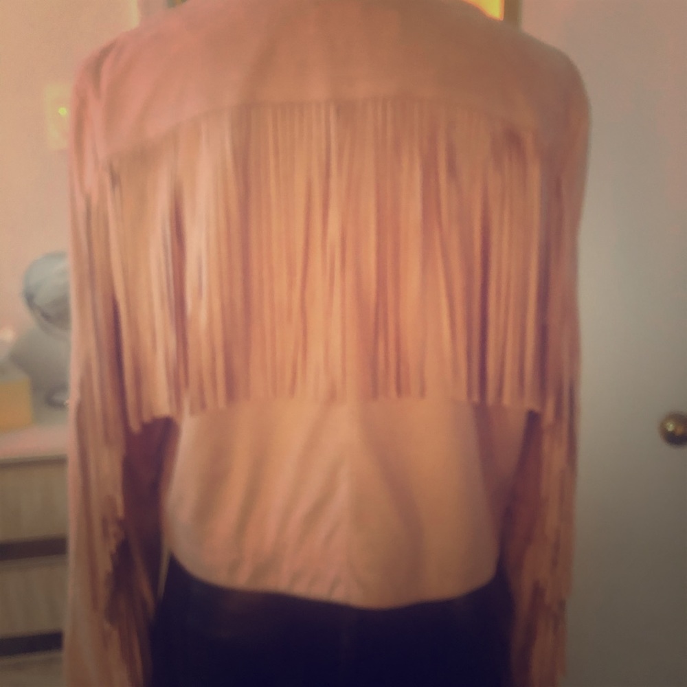 FRINGE FRINGE FRINGE. Faux suede pale pink jacket with fringe.